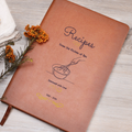 Brown recipe book with 'Recipes' title and illustrations on a wooden surface