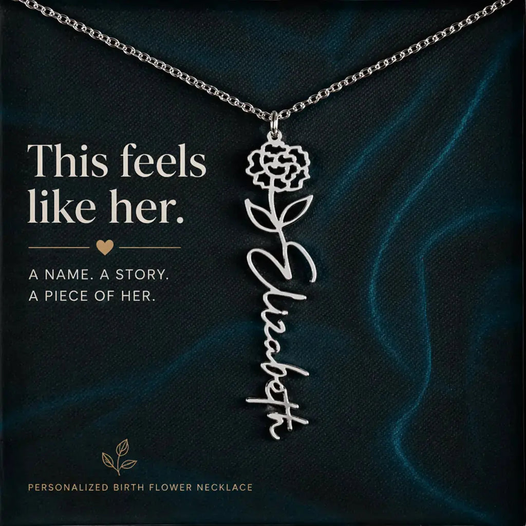 Personalized birth flower necklace with floral design and name 'Elizabeth' on a dark background.