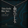 Personalized birth flower necklace with floral design and name 'Elizabeth' on a dark background.