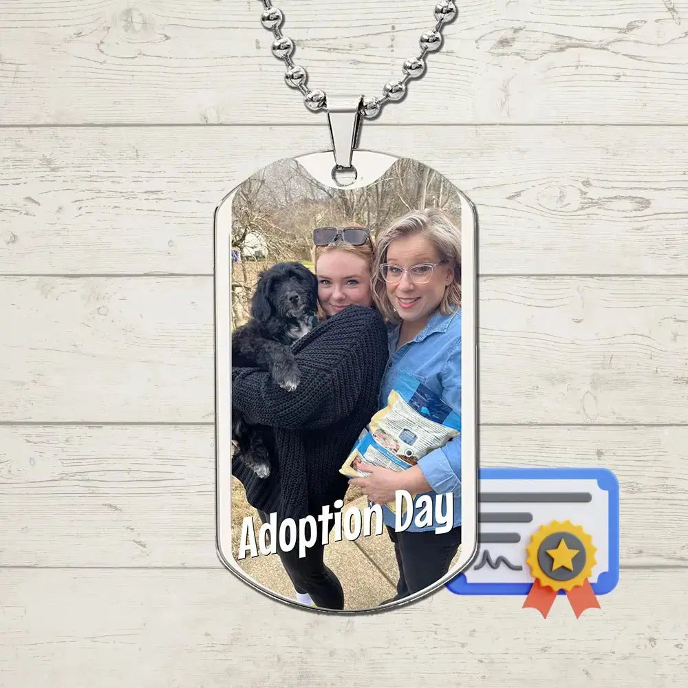 Mother and daughter holding their adopted black dog on Adoption Day, featured on a custom photo dog tag necklace keepsake