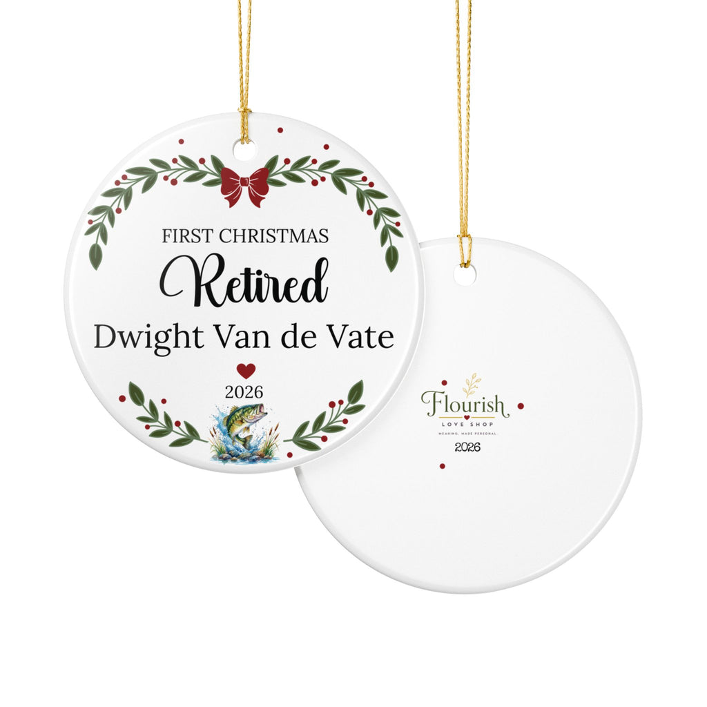 Two round ceramic Christmas ornaments shown on a white background, one front view and one back view. The front ornament has a holiday wreath design with green leaves, red berries, a red bow, and personalized text reading 'FIRST CHRISTMAS Retired Dwight Van de Vate 2026.