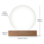Round acrylic plaque on a wooden base with dimensions labeled for height, width, and thickness.