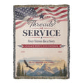Woven veteran blanket featuring a US flag, eagle, mountain landscape, and patriotic text on a fringed throw.