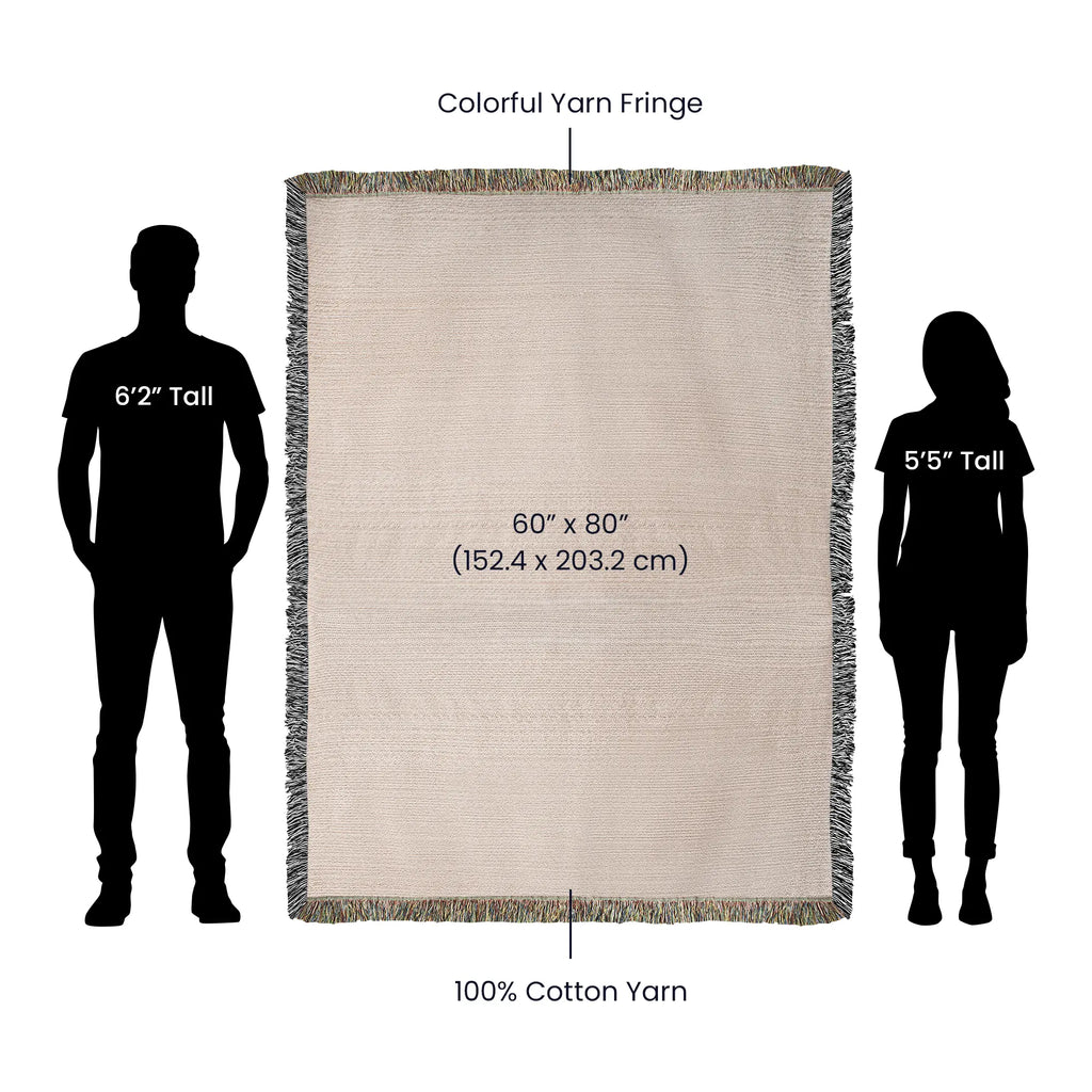 60x80 inch beige woven cotton blanket with colorful yarn fringe, shown for scale next to human silhouettes.