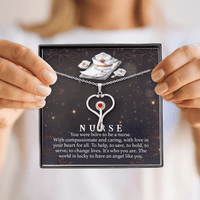 A person is holding the box of Born to be a Nurse Love Shop