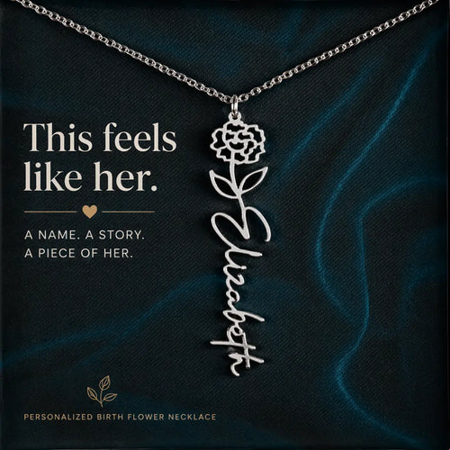 Personalized birth flower necklace with floral design and name 'Elizabeth' on a dark background.